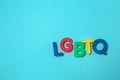 Abbreviation LGBTQ on color background