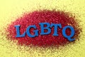 Abbreviation LGBTQ with glitters on color background