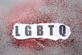 Abbreviation LGBTQ with glitters on grey background