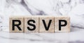 The abbreviation rsvp request for a response from an invited person is written