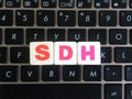 Abbreviation SDH on keyboard background