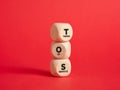 The abbreviation TOS terms of service on wooden cubes with red background