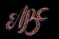 ABC - The capital letters handwritten made of multicolored luminous circles isolated on black background Royalty Free Stock Photo