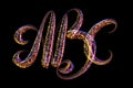 ABC - The capital letters handwritten made of multicolored luminous circles isolated on black background Royalty Free Stock Photo