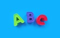 Abc letters isolated on blue background. banner, alphabet brightly toy, learning