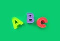 Abc letters isolated on green background. banner, alphabet brightly toy, learning Royalty Free Stock Photo