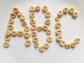 ABC letters spelled out with honey nut cheerios cereal