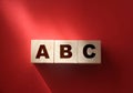 ABC letters wooden blocks on red. Education concept Royalty Free Stock Photo