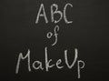 ABC of make up chulk title on black desk. Royalty Free Stock Photo