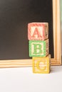 ABC Wooden blocks against chalkboard Royalty Free Stock Photo