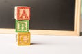 ABC Wooden blocks against chalkboard Royalty Free Stock Photo