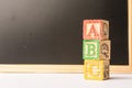 ABC Wooden blocks against chalkboard