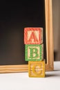 ABC Wooden blocks against chalkboard Royalty Free Stock Photo