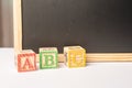 ABC Wooden blocks against chalkboard Royalty Free Stock Photo