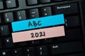 ABC 2021 write on sticky notes isolated on office desk