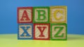 ABC and XYZ wood block on surface.