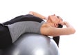 Abdominal crunches by fit woman on exercise ball