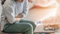 Abdominal pain patient woman having medical exam with doctor on illness from stomach cancer, irritable bowel syndrome Royalty Free Stock Photo