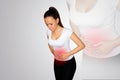 Abdominal pain. A young woman suffers from pain in the abdomen. The problem with digestion. The problem of women`s health, the co Royalty Free Stock Photo