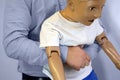 Abdominal thrusts the Heimlich maneuver or Heimlich manoeuvre on a simulation mannequin child dummy during medical training