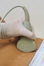 Abdominal ultrasound convex probe in left hand scanning female stomach