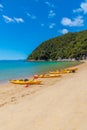 ABEL TASMAN, NEW ZEALAND, FEBRUARY 6, 2020: Yellow kayaks at Onetahuti beach at Abel Tasman national park in New Zealand