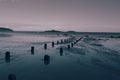 Aberdaron beach with old wooden posts, on the Llyn Peninsula in North Wales.