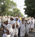 Blind children dressed as Gandhi walking on street