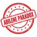 ABILENE PARADOX text on red grungy round rubber stamp