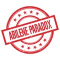 ABILENE PARADOX text written on red vintage round stamp