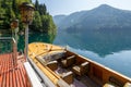 Beautiful vintage speed boat is moor at the pier on Lake Ritsa. View of the fore part of boat