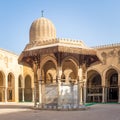 Ablution fountain mediating courtyard of historic mosque of Sultan al Muayyad, arched corridors and dome, Cairo, Egypt Royalty Free Stock Photo