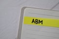 ABM write on sticky notes isolated on office desk