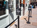 Abnormal beauty company shop entrance with a sign for click and collect.