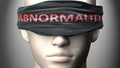 Abnormality can make things harder to see or makes us blind to the reality - pictured as word Abnormality on a blindfold to