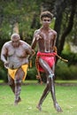 Aboriginal Australians men dancing traditional dance during Australia Day celebrations