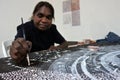 Aboriginal female artist dot painting