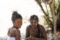 The Aboriginal girls decorate their faces, Amoronia orange coast, Madagascar