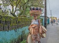 An aboriginal malagasy woman is selling some handicraft on the street