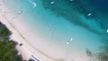 Above angle of happy wedding couple is lying on a tropical sandy beach near the ocean. Aerial view on Attractive Couple Royalty Free Stock Photo