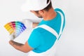 Unrecognizable male painter examining color samples Royalty Free Stock Photo