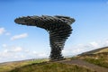 This is a public artwork taking the form of a wind blown tree which is made of steel pipes and it is situated high on the Moors