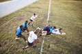 Above caucasian rugby player diving to score a try during a rugby match outside on a field. Male athlete making a dive Royalty Free Stock Photo