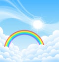 above clouds blue sky with sun and rainbow Royalty Free Stock Photo
