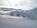 Above the clouds high in the mountains in Austria, a great landscape in winter