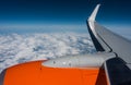 Above the clouds. Holiday flight, view out the airplane window. Royalty Free Stock Photo