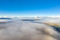 Above the clouds at Portnoo in County Donegal with fog - Ireland Royalty Free Stock Photo