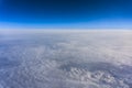 Above clouds, view from pilot cabine airplane. Blue sky, white clouds with magic and soft sun light. Royalty Free Stock Photo