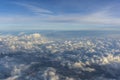 Above clouds, view from pilot cabine airplane. Blue sky, white clouds with magic and soft sun light. Royalty Free Stock Photo