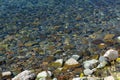 full frame of textured rough grey stony surface partly covered with water Royalty Free Stock Photo